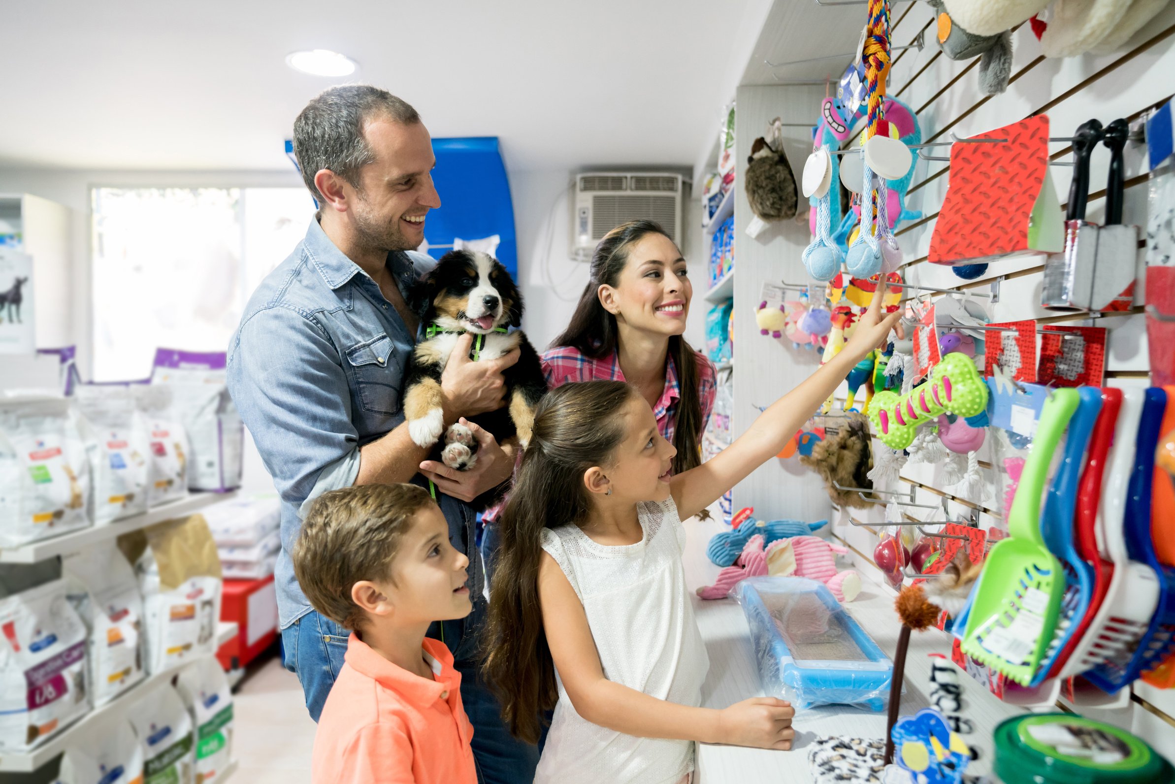 Happy family shopping at a pet shop